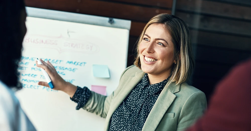 Woman in front of board