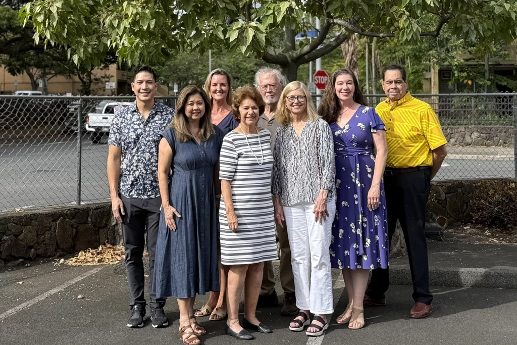 Group of people in front of tree